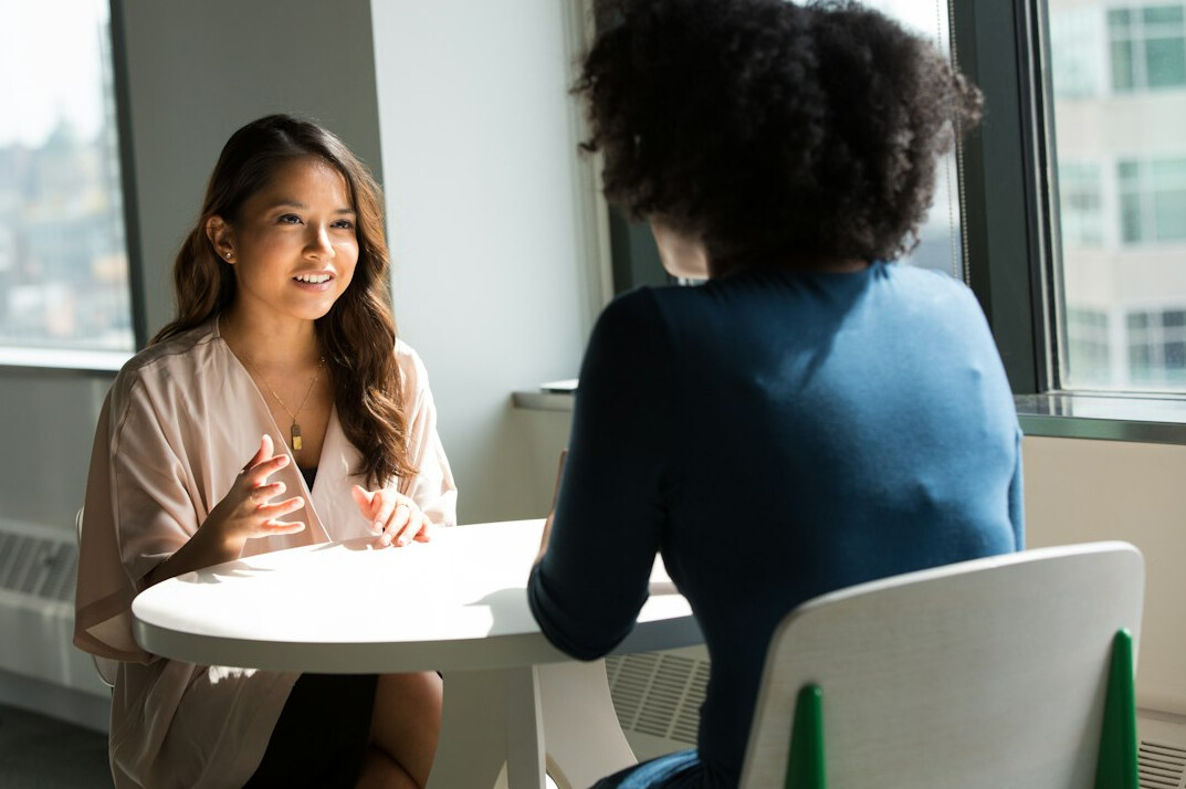person speaking confidently in meeting
