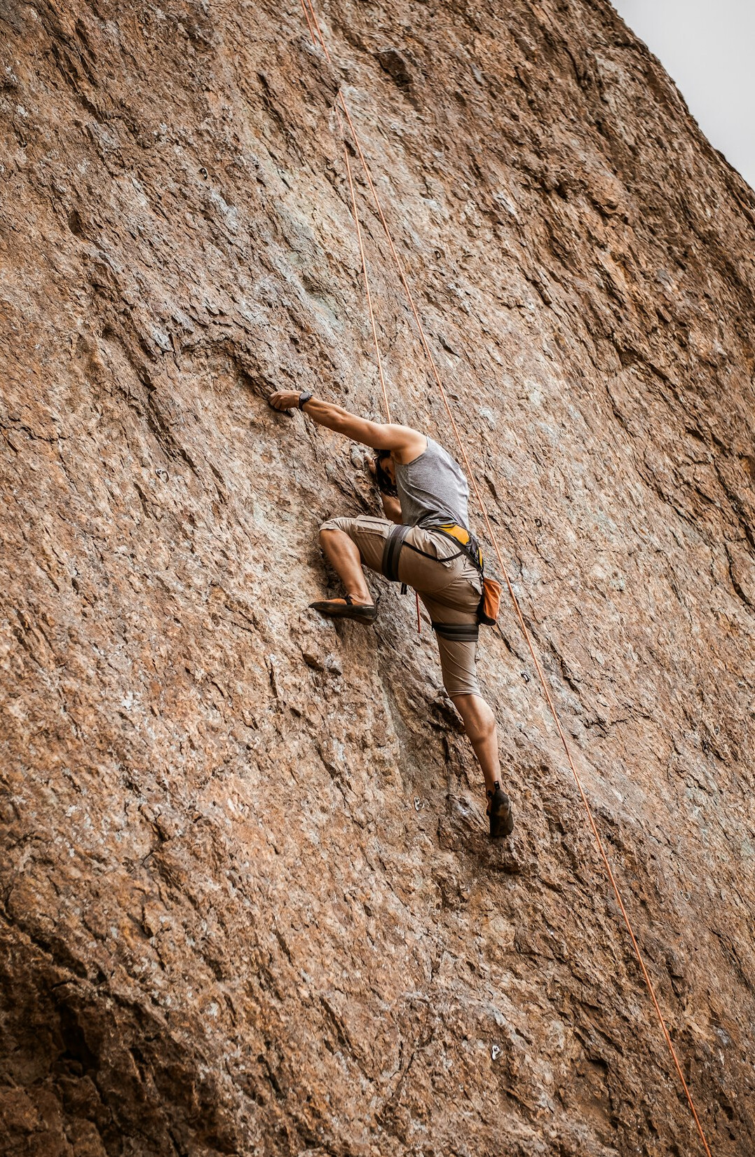 person climbing mountain metaphor