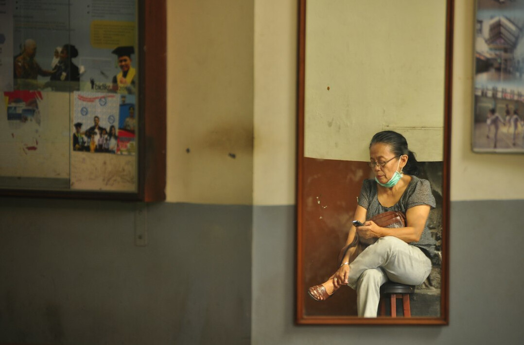 woman practicing speech in mirror
